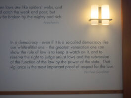Quotes on the wall inside of Wassersetein Hall related to the rule of law. The first reads: "'Written laws are like spiders' webs, and would catch the weak and poor, but easily be broken by the mighty and rich.'” -Anacharsis" The second reads: “'In a democracy - even if it is a so-called democracy like our white-élitist one - the greatest veneration one can show the rule of law is to keep a watch on it, and to reserve the right to judge unjust laws and the subversion of the function of the law by the power of the state. That vigilance is the most important proof of respect for the law.' -Nadine Gordimer"