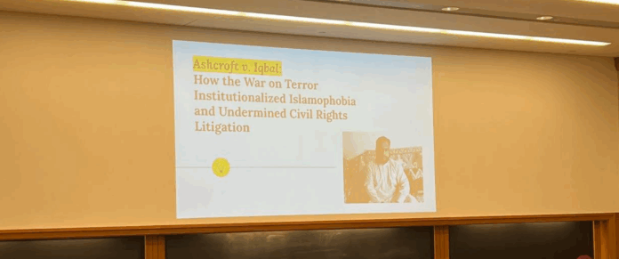 Screenshot 2025-05-01 011743 Presentation in a classroom in a Wasserstein hall section classroom reads "Ashcroft v. Iqbal: How the War on Terror Institutionalized Islamophobia and Undermined Civil Rights Litigation" (I. Bharmal, 2022).